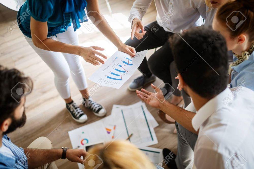 112799471-startup-business-team-on-meeting-in-modern-bright-office-interior-brainstorming-working-on-computer